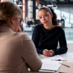 Photo of a young woman interviewing for a job