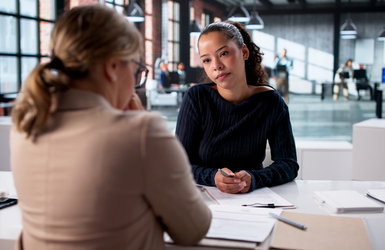 Photo of a young woman interviewing for a job